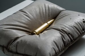 Gold bullet sculpture by Amarist Studio